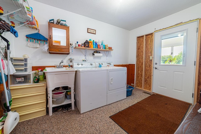 laundry room with separate washer and dryer