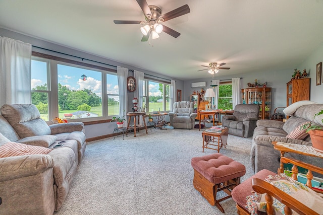 living room featuring carpet flooring, ceiling fan, and a wall unit AC