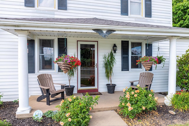 doorway to property featuring covered porch