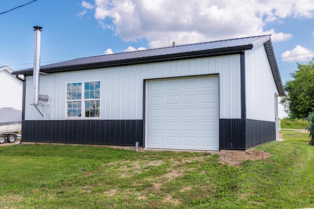 garage featuring a yard