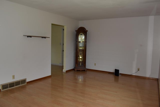 spare room featuring light hardwood / wood-style floors