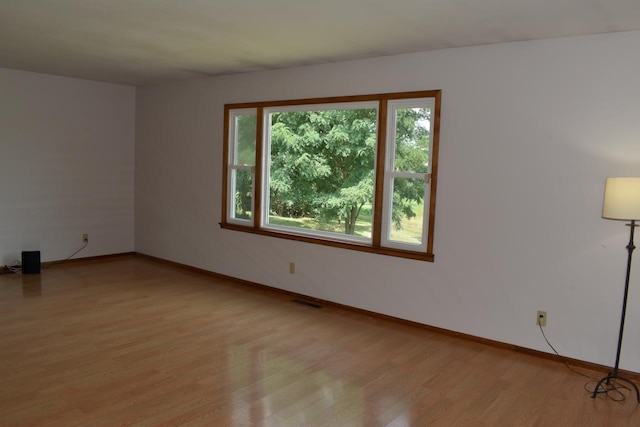 unfurnished room featuring light hardwood / wood-style flooring