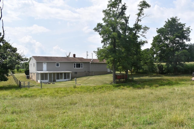 view of yard with a sunroom