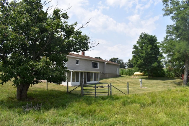 view of yard with a sunroom