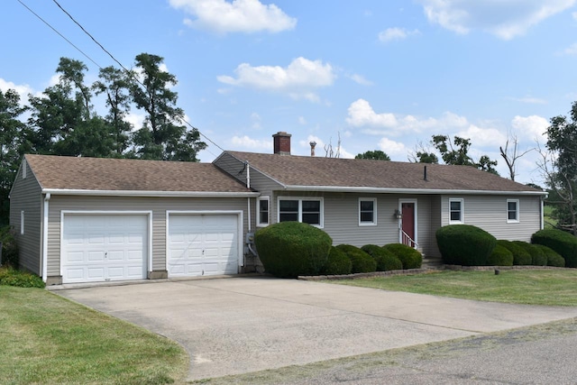 ranch-style house featuring a front yard and a garage