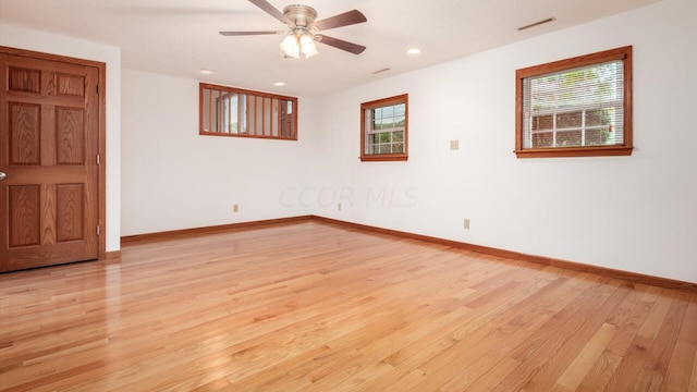 spare room with ceiling fan and light hardwood / wood-style flooring