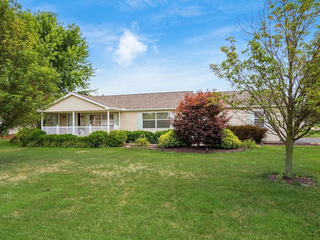 single story home with covered porch and a front yard