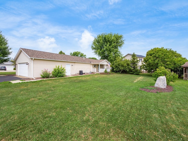 view of yard with a garage