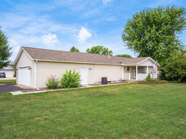 single story home with a front yard, a porch, and a garage