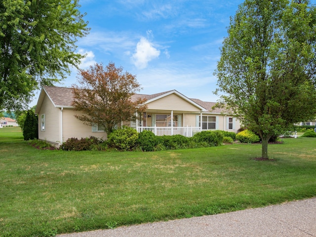 ranch-style house with a porch and a front yard