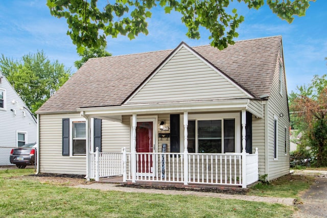 bungalow-style home with a front lawn