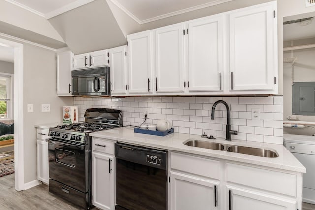 kitchen with black appliances, sink, decorative backsplash, light wood-type flooring, and white cabinetry