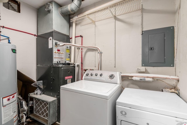 washroom with gas water heater, independent washer and dryer, and electric panel