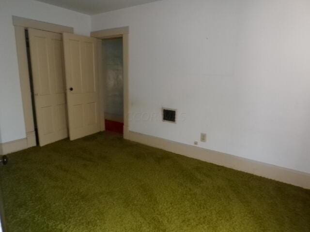 spare room featuring carpet