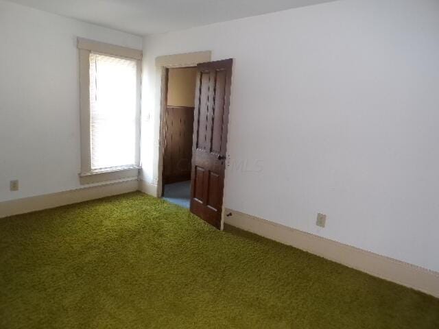 empty room with carpet flooring