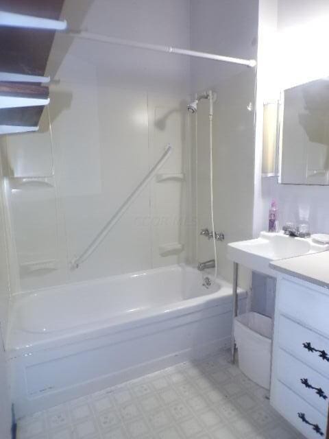 bathroom featuring vanity and shower / bathtub combination