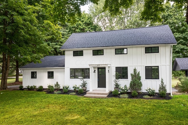 modern inspired farmhouse with a front yard