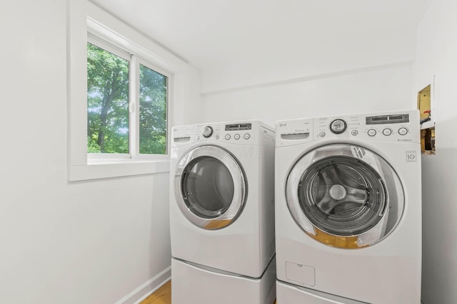 laundry room featuring washing machine and dryer