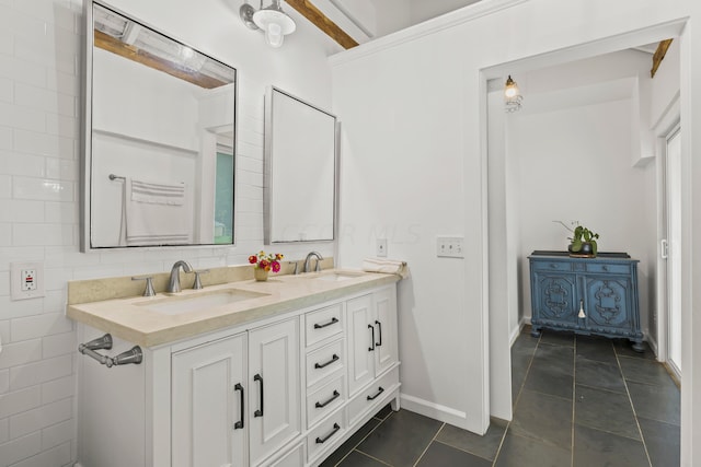 bathroom with tile patterned floors, vanity, and tile walls