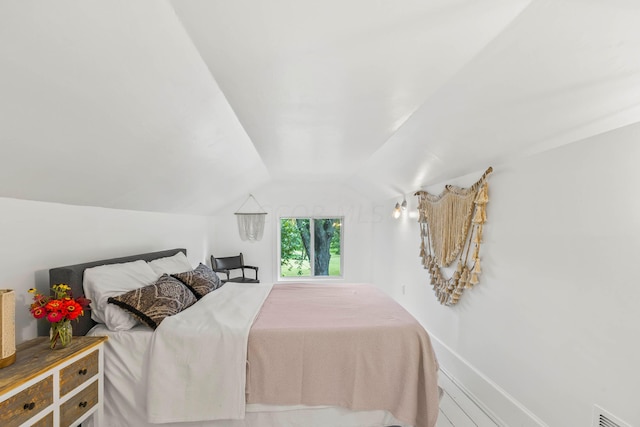 bedroom featuring vaulted ceiling