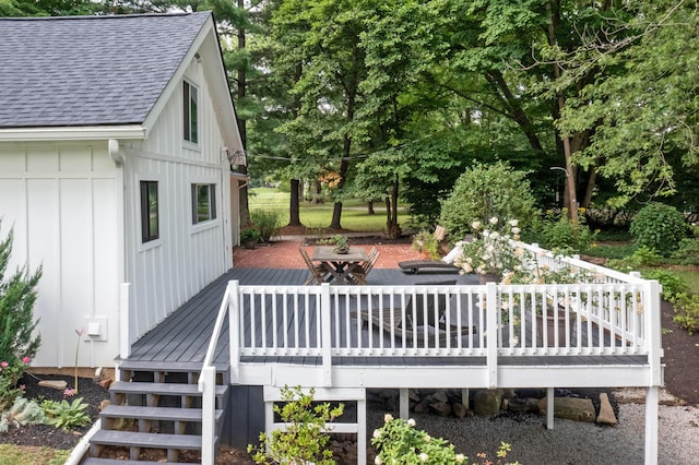 wooden terrace with a patio