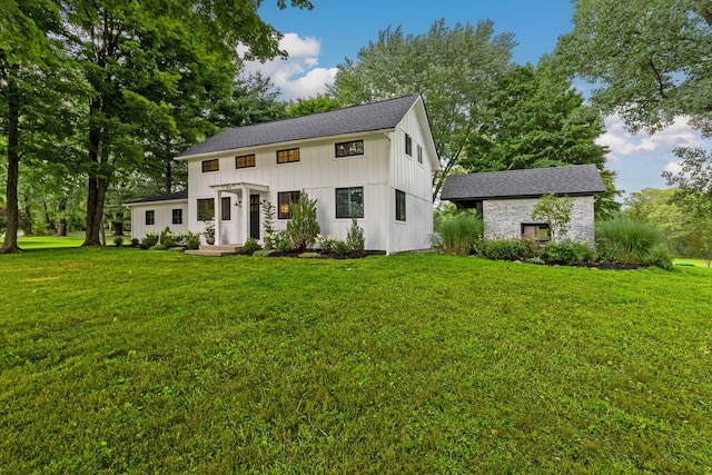 view of front of home with a pergola and a front lawn