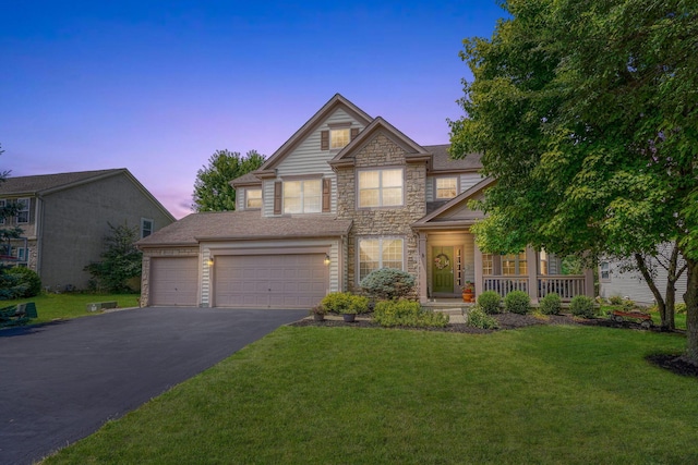 7265 Bromfield Dr, Canal Winchester, OH 43110 - traditional-style house featuring stone siding, driveway, a front lawn, and a porch