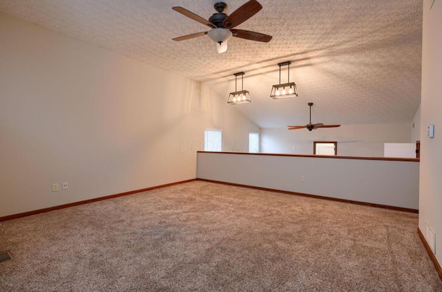 7265 Bromfield Dr, Canal Winchester, OH 43110 - carpeted spare room featuring a ceiling fan, a textured ceiling, and vaulted ceiling