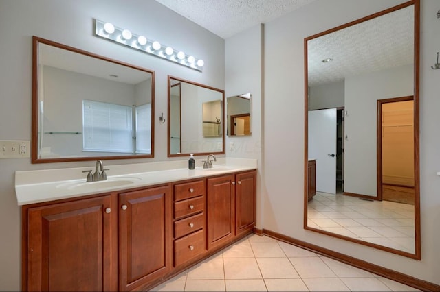 7265 Bromfield Dr, Canal Winchester, OH 43110 - full bath with a textured ceiling, double vanity, and tile patterned flooring