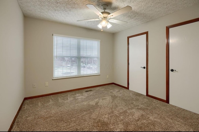 7265 Bromfield Dr, Canal Winchester, OH 43110 - unfurnished bedroom featuring carpet flooring, a textured ceiling, and a ceiling fan