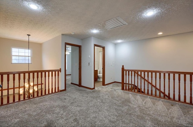 7265 Bromfield Dr, Canal Winchester, OH 43110 - carpeted spare room featuring a textured ceiling, recessed lighting, and a chandelier