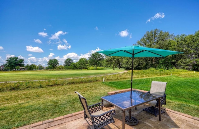 7265 Bromfield Dr, Canal Winchester, OH 43110 - deck featuring a patio, a lawn, and view of scattered trees