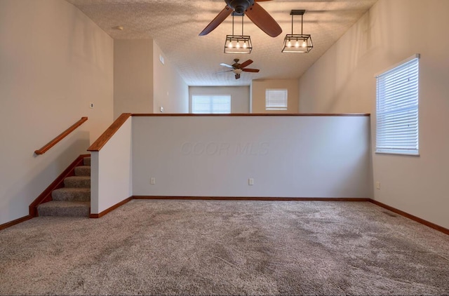 7265 Bromfield Dr, Canal Winchester, OH 43110 - empty room with ceiling fan, carpet flooring, and a textured ceiling