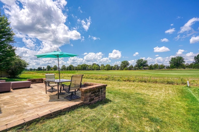 7265 Bromfield Dr, Canal Winchester, OH 43110 - view of green lawn with a patio area and a rural view