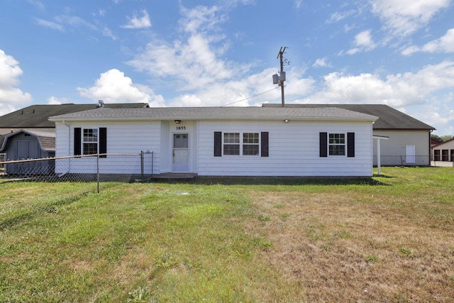 back of house with a yard