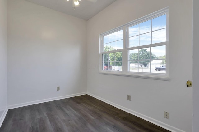 unfurnished room with ceiling fan and dark hardwood / wood-style flooring