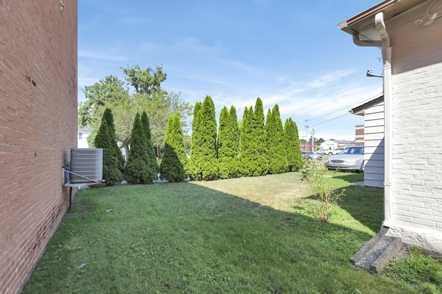 view of yard featuring central AC unit