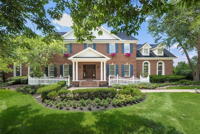 colonial home with a front lawn