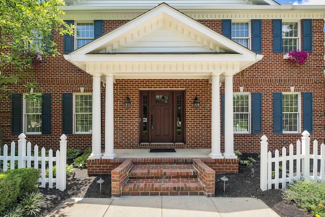 entrance to property with a porch