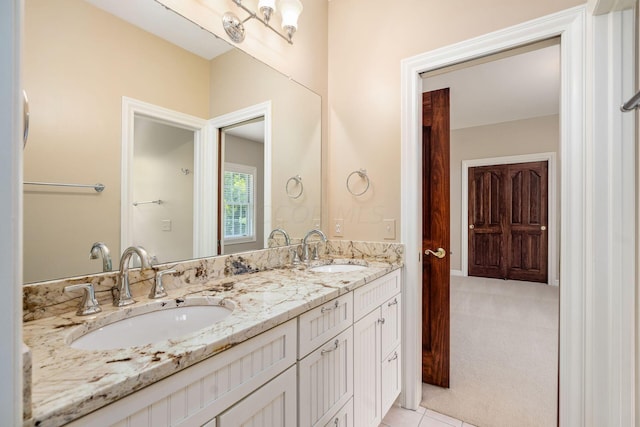 bathroom with tile patterned flooring and vanity