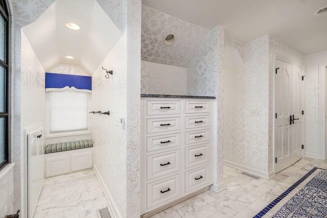 bathroom with vaulted ceiling