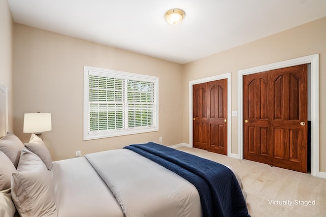 carpeted bedroom with a closet