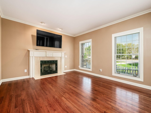 unfurnished living room with a fireplace, hardwood / wood-style flooring, and crown molding