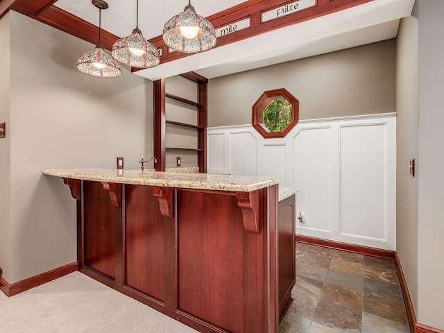 bar featuring hanging light fixtures