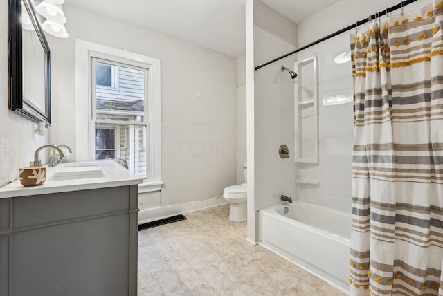 full bathroom with vanity, toilet, and shower / bath combo with shower curtain