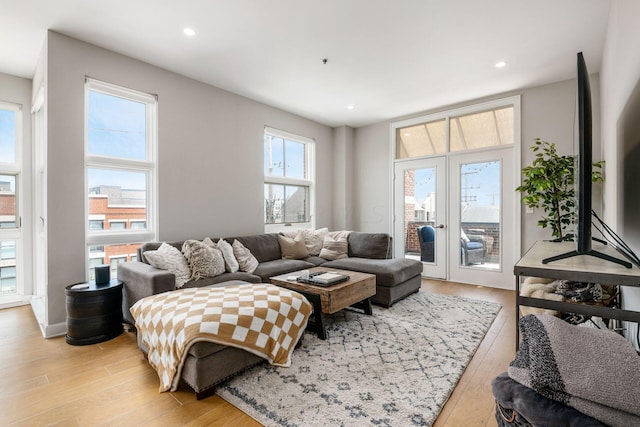 living room featuring light hardwood / wood-style flooring and french doors