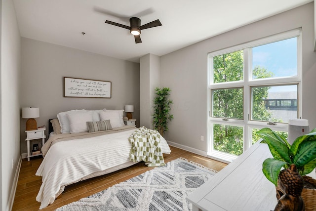 bedroom featuring hardwood / wood-style floors and ceiling fan