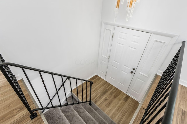 stairway featuring hardwood / wood-style flooring