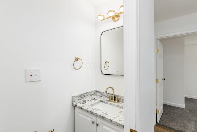 bathroom featuring hardwood / wood-style flooring and vanity