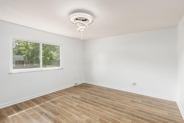 empty room featuring wood-type flooring